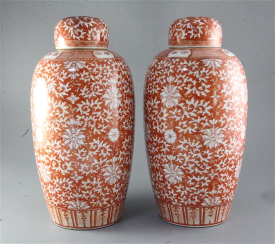 A pair of Chinese rouge-de-fer decorated ovoid vases, 19th century, height 38cm